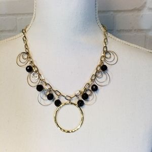 Goldtone circles and black facet beads necklace